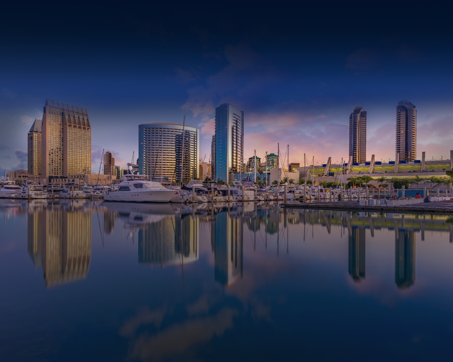 The San Diego skyline and marina at dusk, host city of ICSC @Western 2026